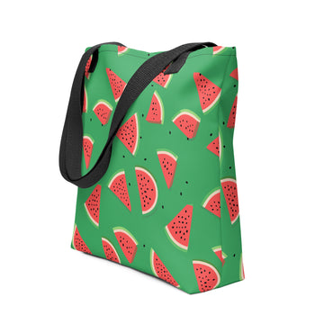 Colorful watermelon print tote bag with black handles on a green background.