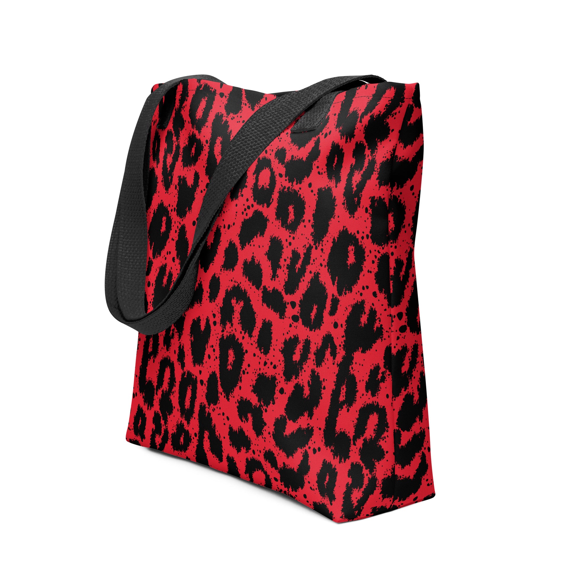 Vibrant red leopard print tote bag with black accents and dual handles.