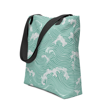 Wave-inspired tote bag showing ocean wave design with dark handles.