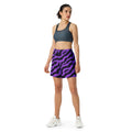 Vibrant purple zebra print athletic long shorts on a model in activewear.