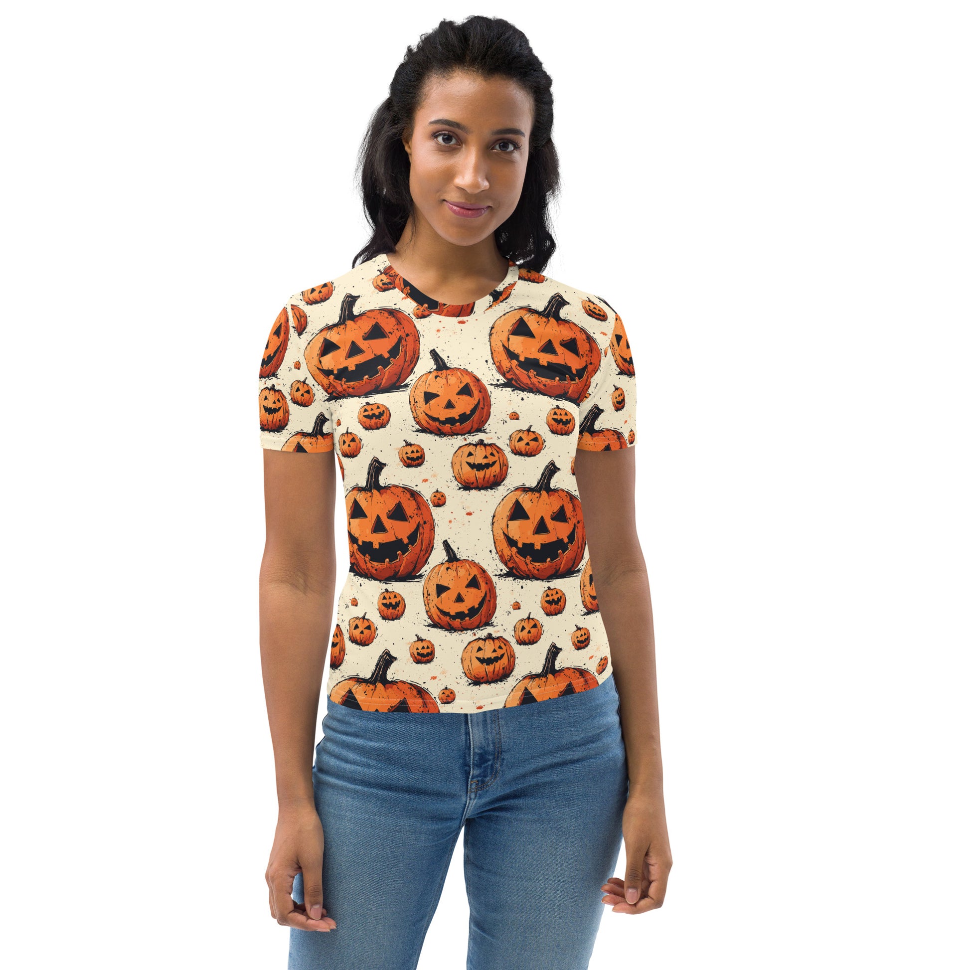 Women's t-shirt with a festive pumpkin Halloween design, featuring jack-o'-lanterns on a cream background.