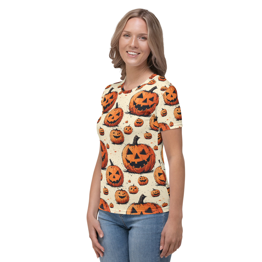 Women's t-shirt with a festive pumpkin Halloween design, featuring jack-o'-lanterns on a cream background.