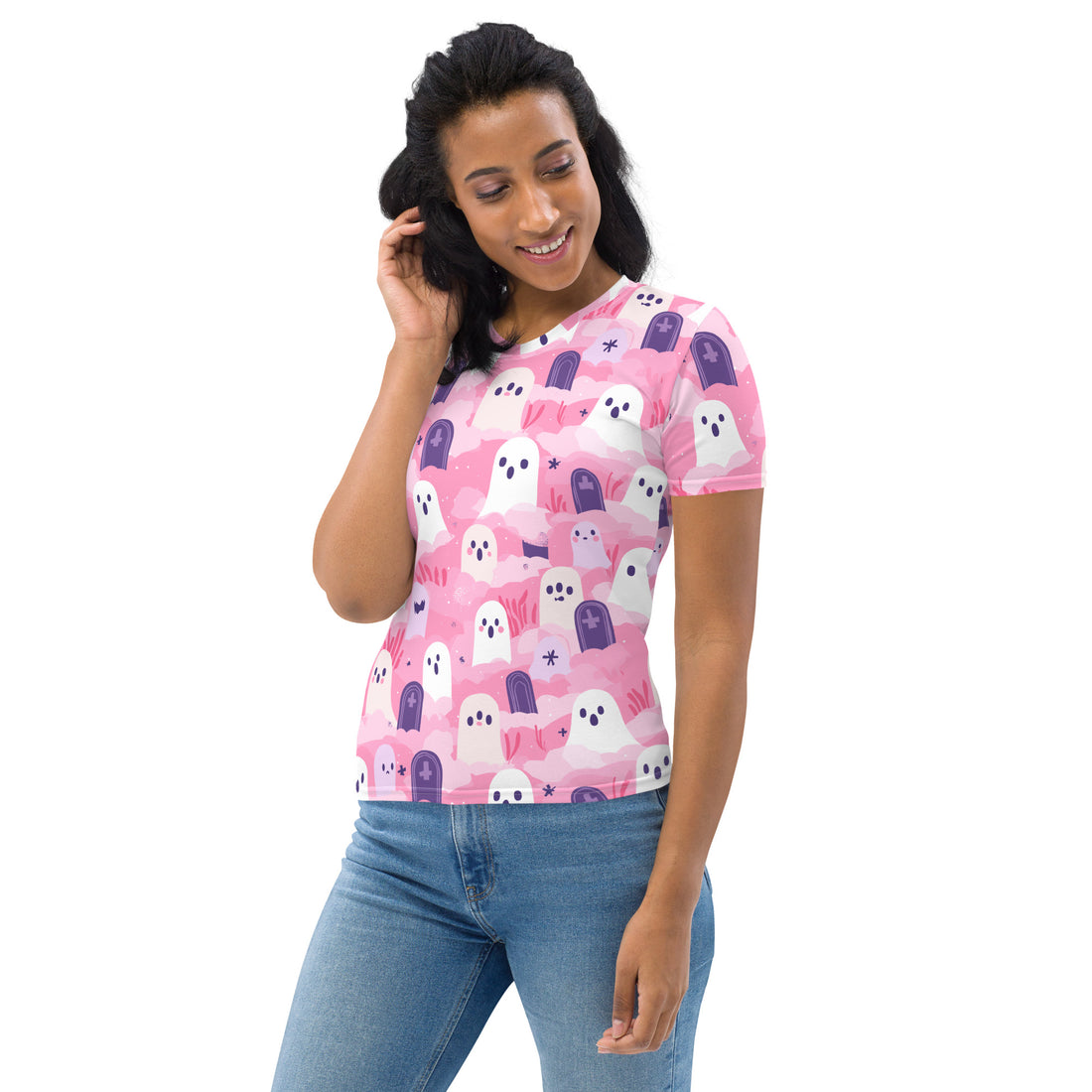 A woman wearing a playful pink Halloween-themed t-shirt with ghost designs.