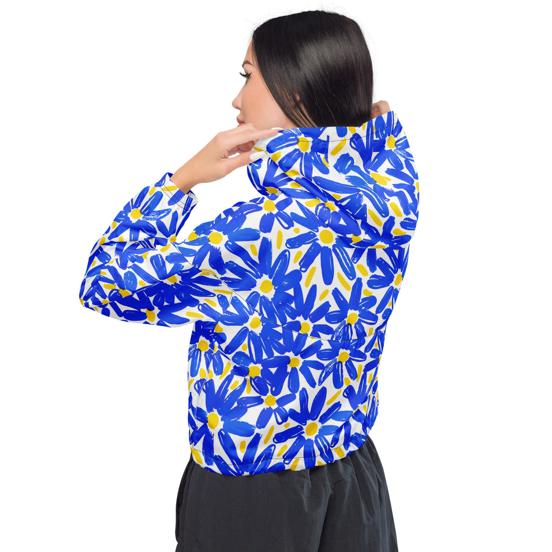 Vibrant floral cropped windbreaker jacket for women in blue and yellow, featuring a model.