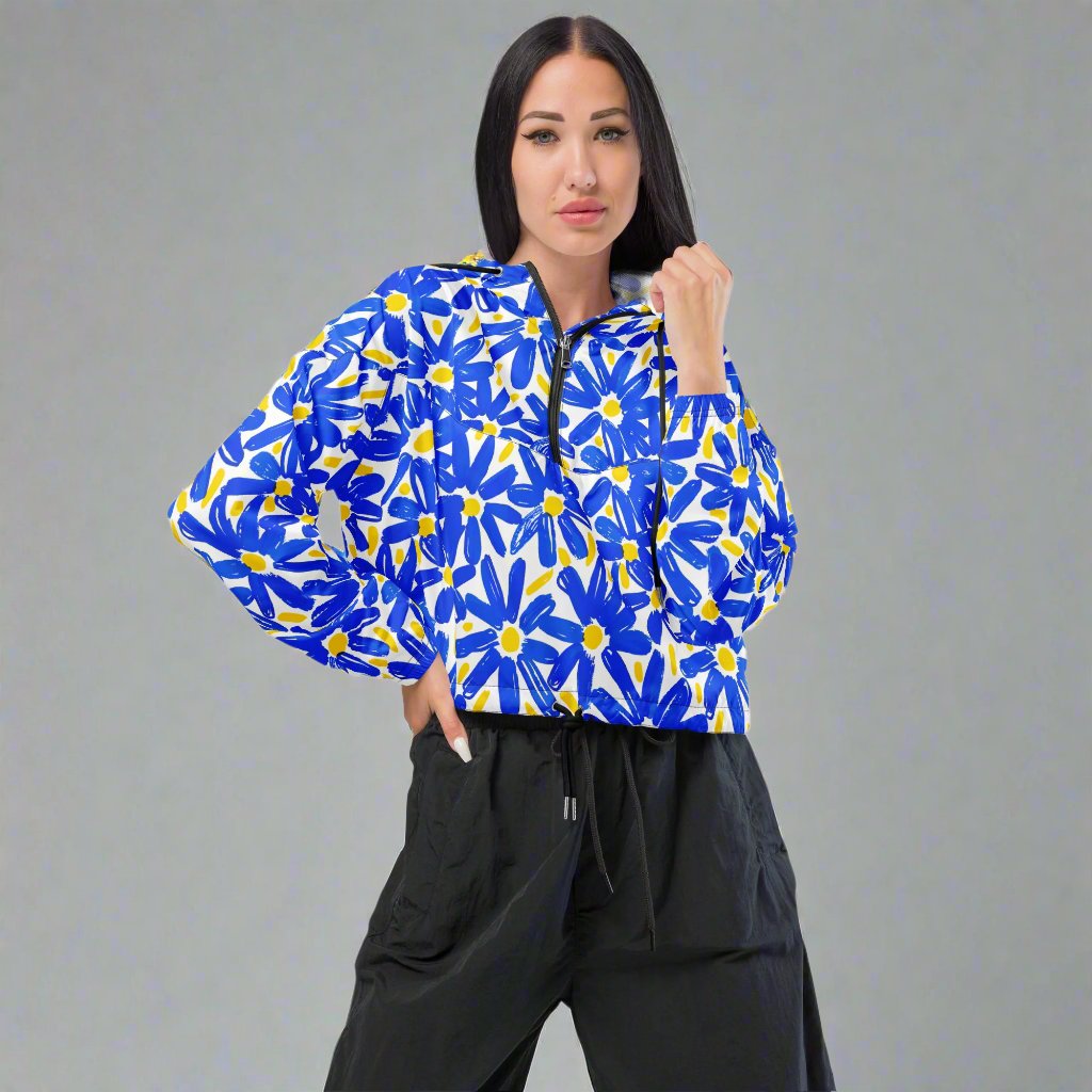 Vibrant floral cropped windbreaker jacket for women in blue and yellow, featuring a model.