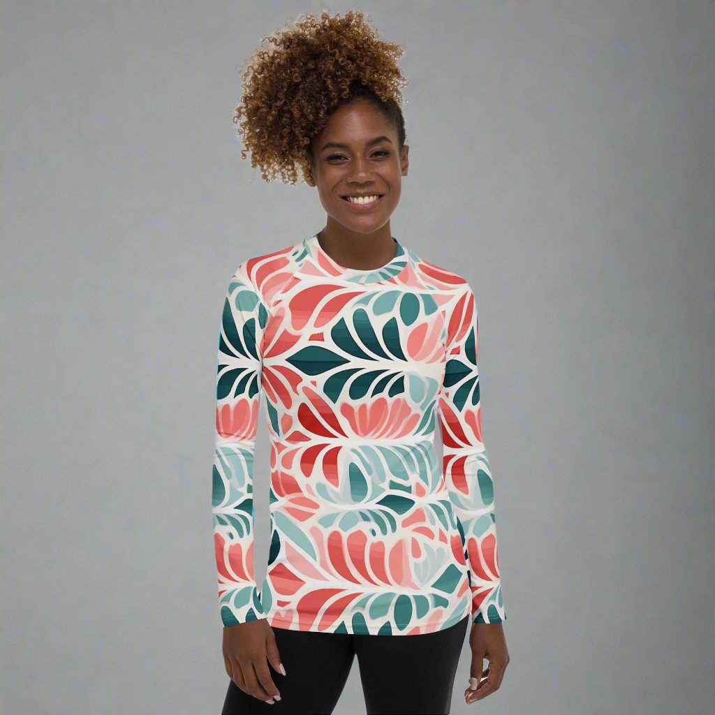 Floral-patterned women's long-sleeve rash guard featuring a colorful design, perfect for active lifestyles.