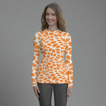 Women's long-sleeve rash guard with bold orange droplet pattern, perfect for active lifestyles.