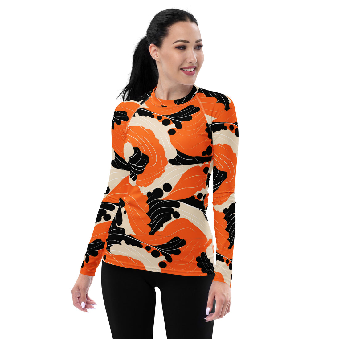 Women's long-sleeve rash guard in vibrant orange and black floral design.