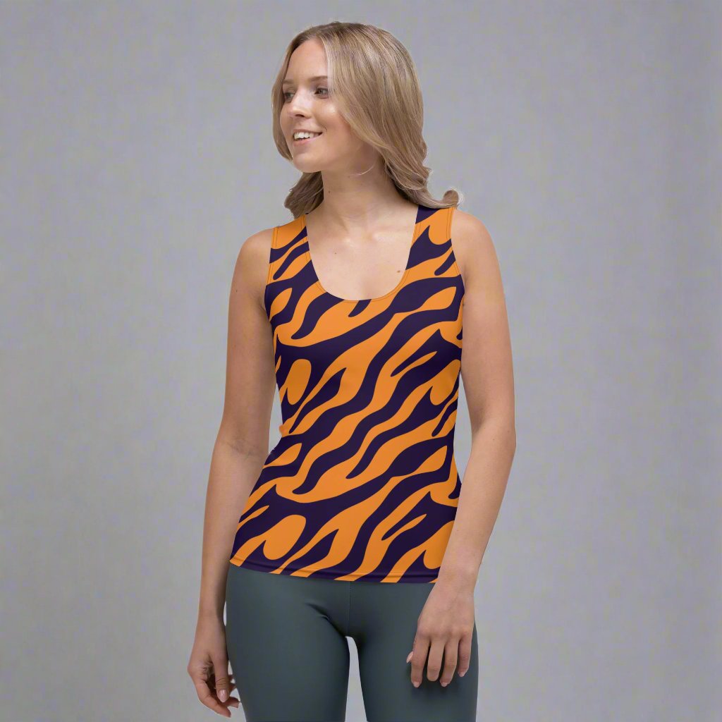 Women wearing a bold animal print tank top featuring orange and navy design.