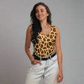 Giraffe print cut and sew tank top worn by a woman in a stylish indoor setting