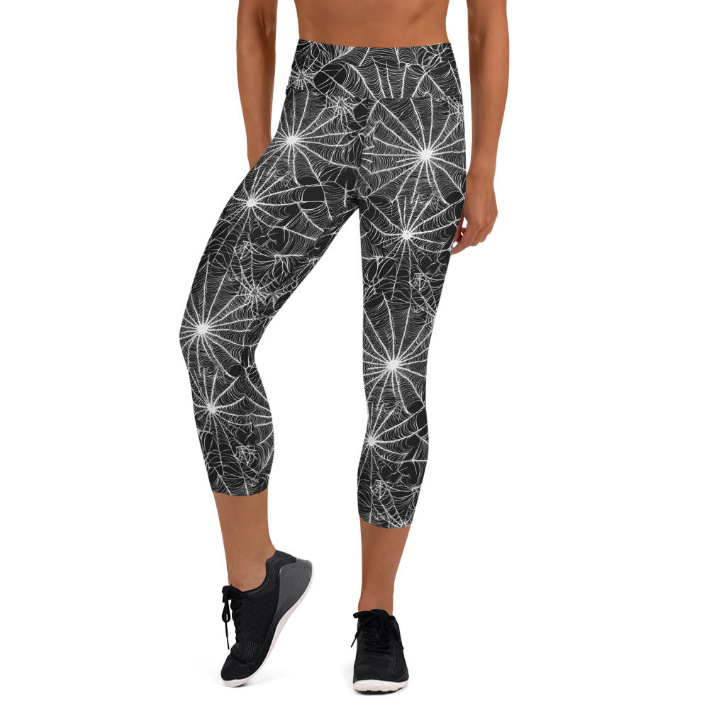 Women's Halloween spiderweb yoga capri leggings in black and white design with high waistband.