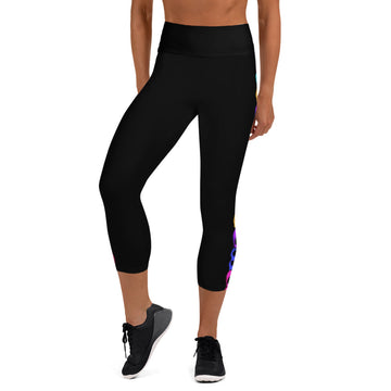 Women’s black yoga capri leggings with colorful Halloween-themed designs on the sides, showcasing a comfortable fit and high waistband.