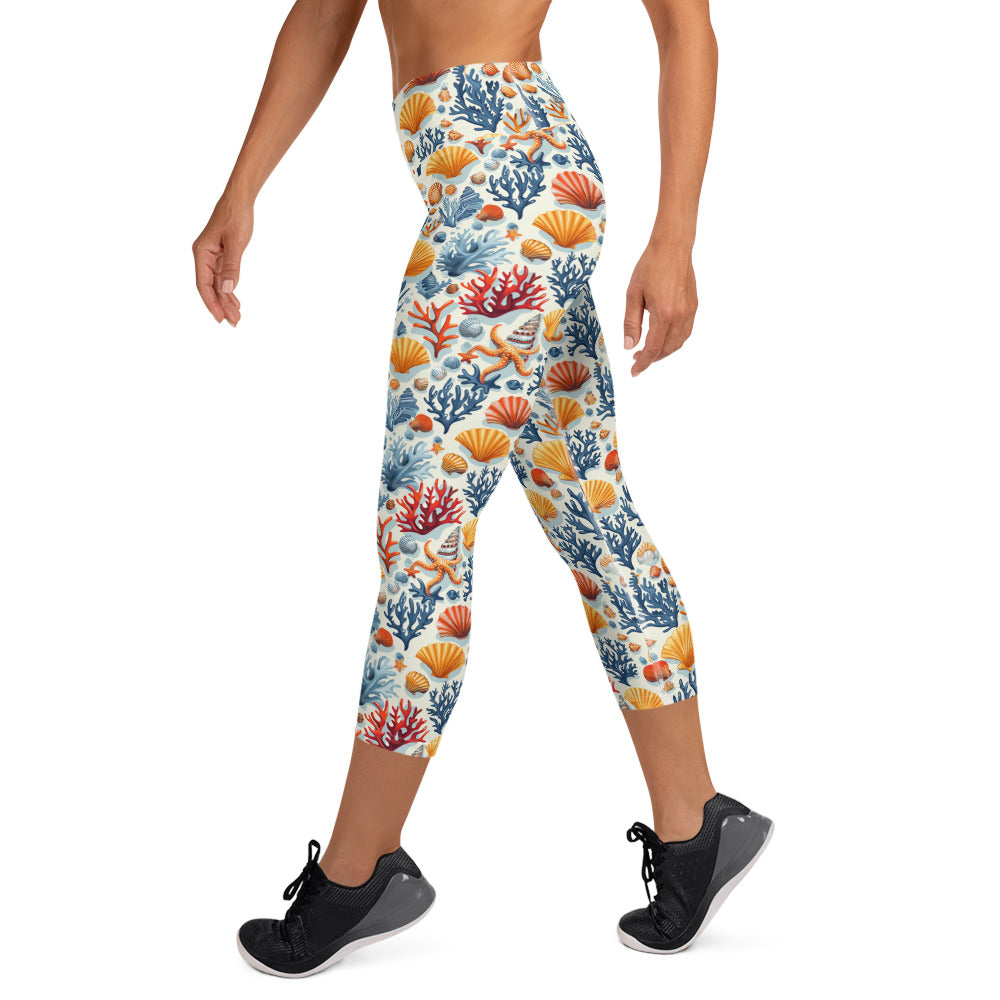 Capri leggings with vibrant oceanic coral and seashell pattern, high waistband, mid-calf length, activewear style