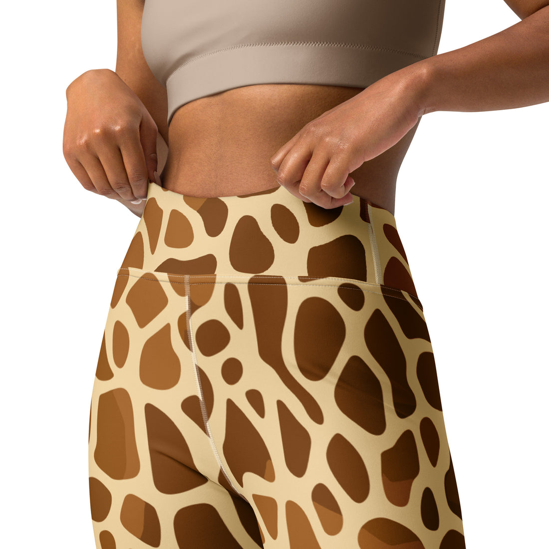 Giraffe print yoga leggings with raised waistband, perfect for workouts.