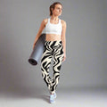 Stylish black and beige wave print yoga leggings, perfect for yoga enthusiasts.