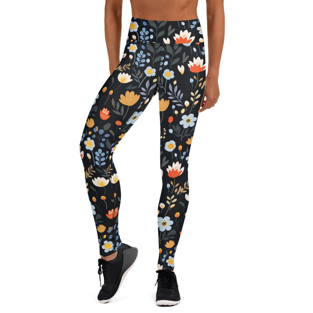 Floral yoga leggings with vibrant red, yellow, and blue flowers on a black background, perfect for winter fashion.