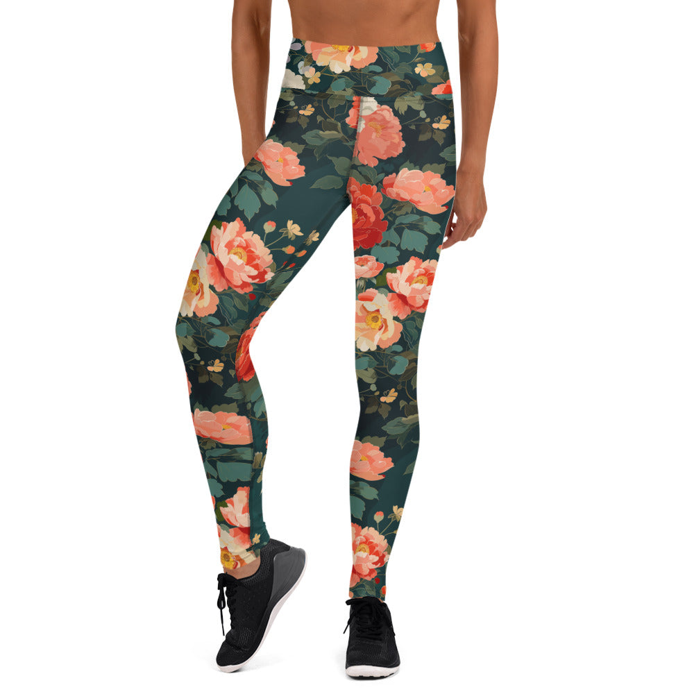 Yoga leggings with a vibrant peony floral design featuring soft pink and green hues on a dark background.