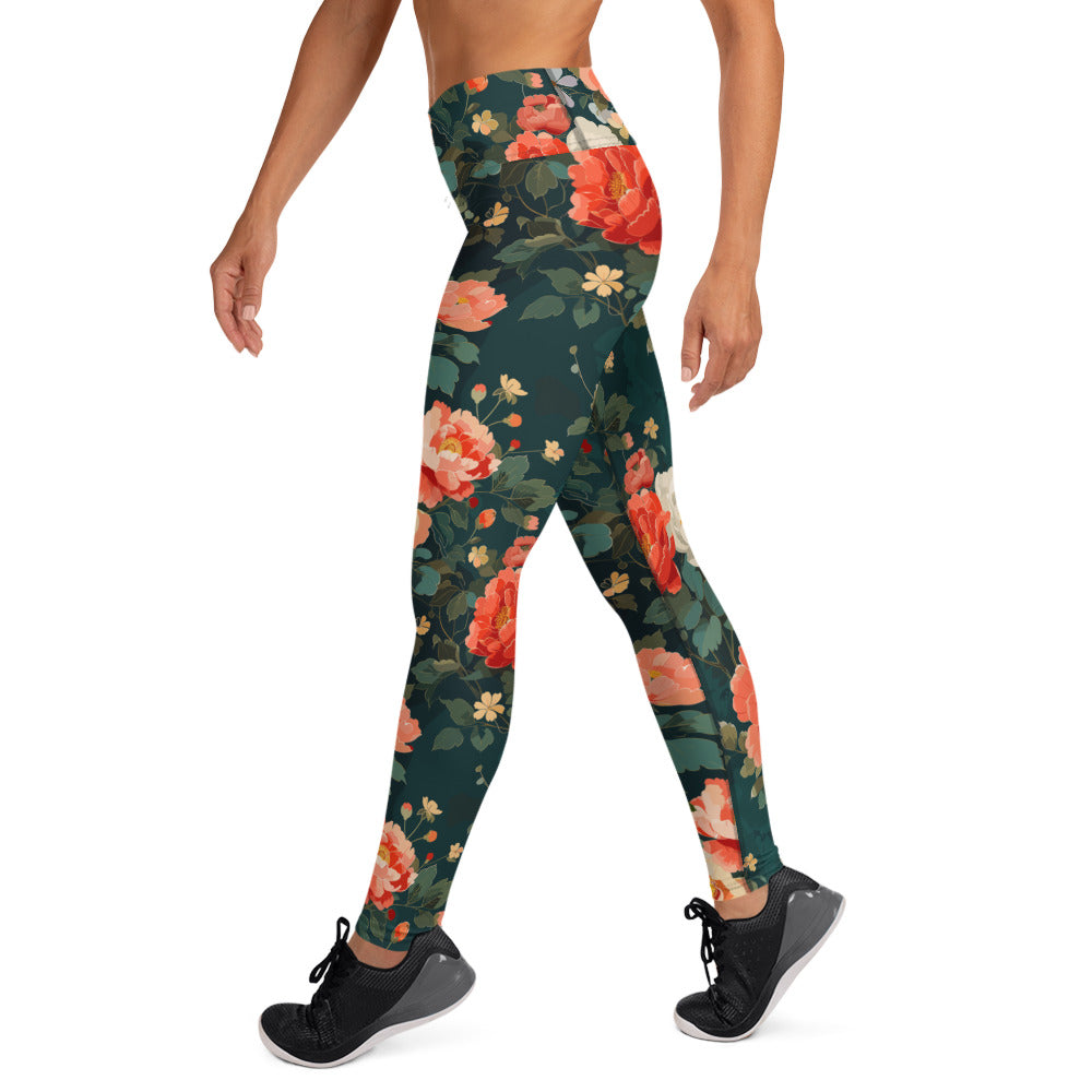 Yoga leggings with a vibrant peony floral design featuring soft pink and green hues on a dark background.