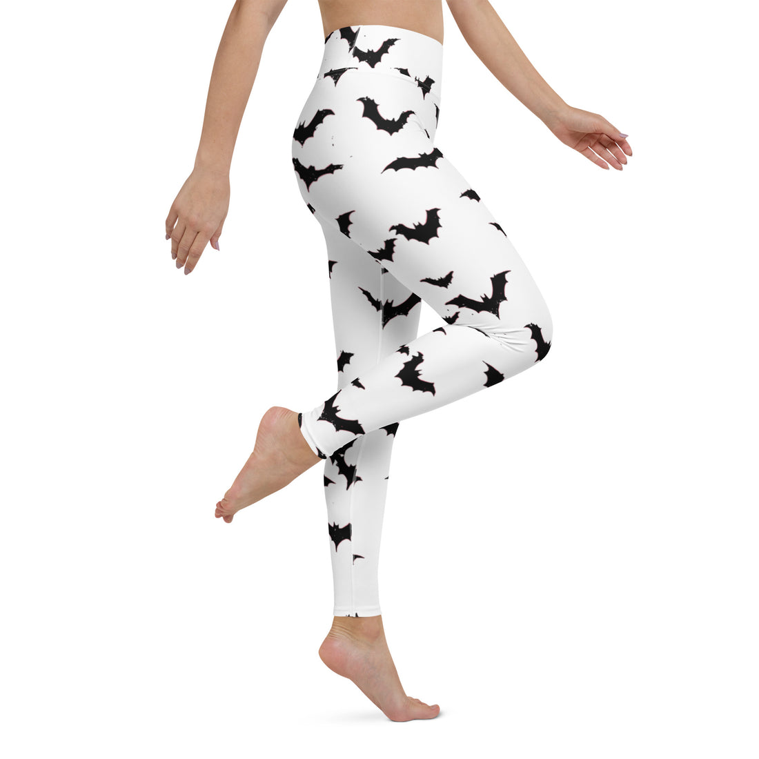 Women wearing white yoga leggings with black bat prints, perfect for Halloween.