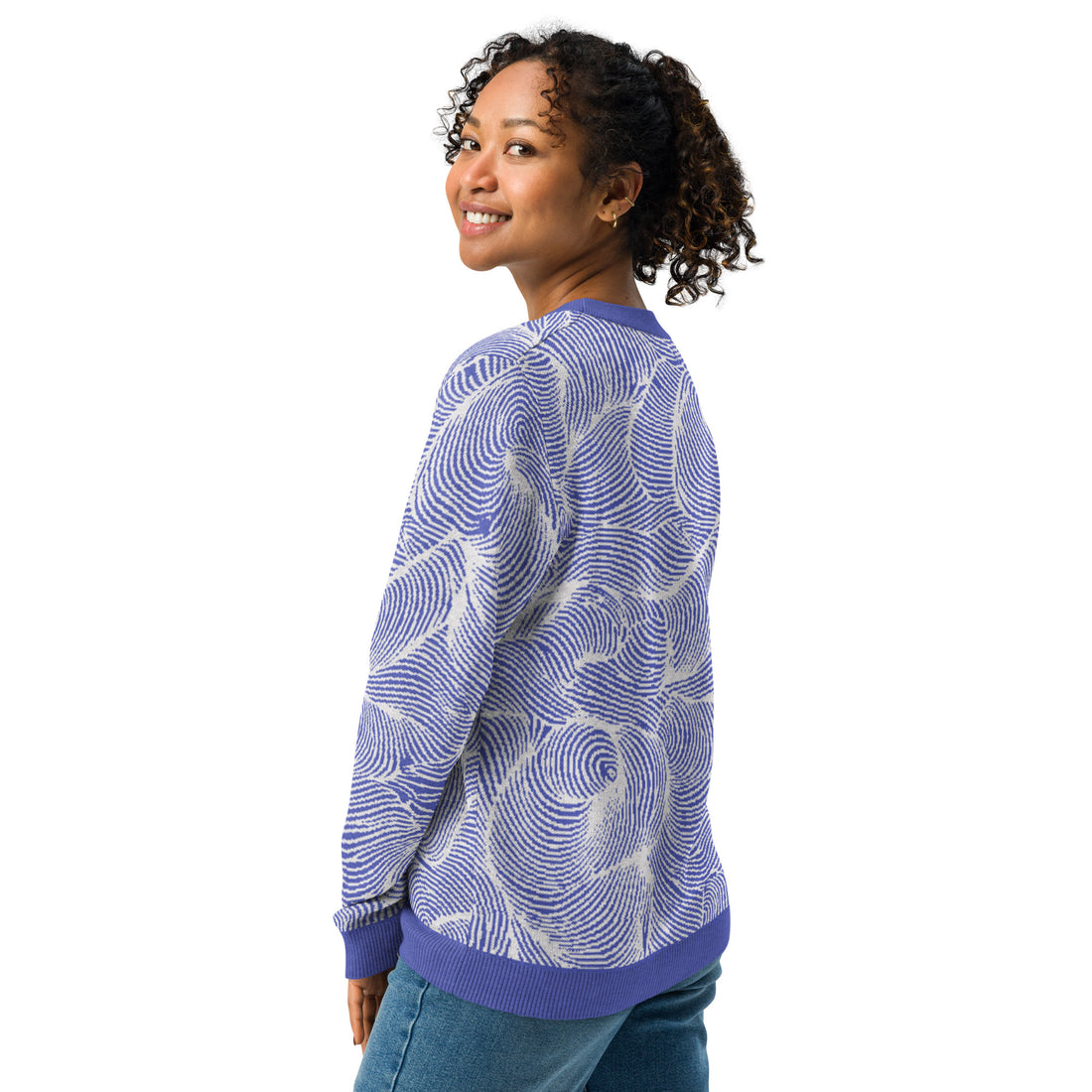 Blue swirl pattern knitted crew neck sweater in abstract design with soft colors, perfect for fall and winter fashion.