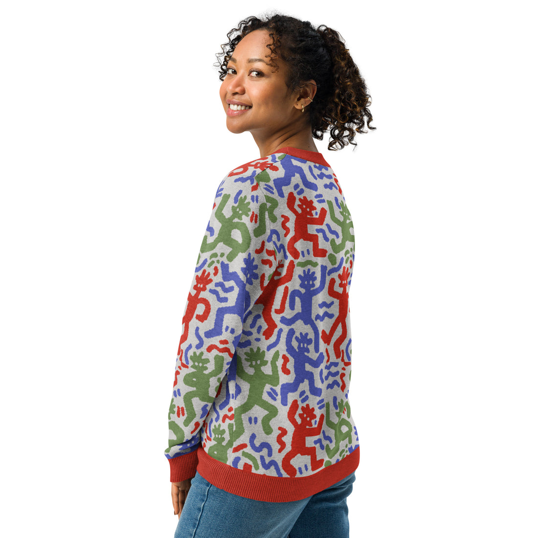 Colorful abstract figure knitted sweater with playful multicolored design, featuring vibrant red, green, and blue hues.