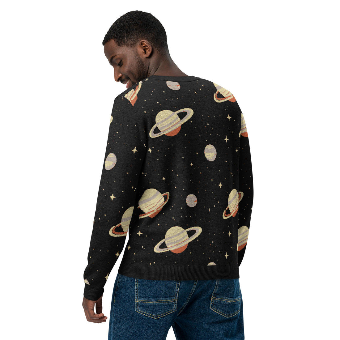 A woman wearing a black knit sweater showcasing Saturn and star designs, perfect for fall and winter fashion.