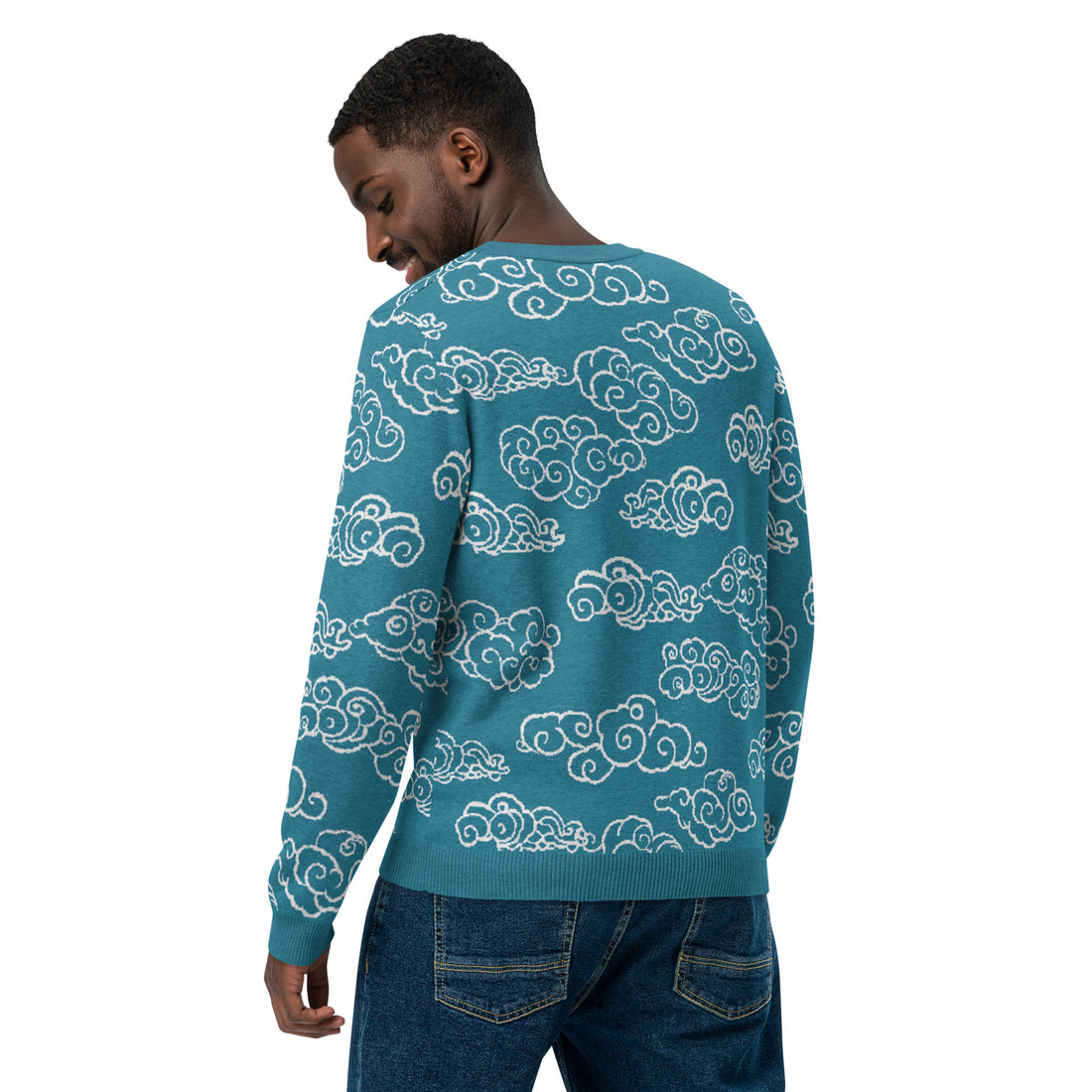 Teal knitted sweater with ivory cloud patterns, showcasing a cozy and stylish design.