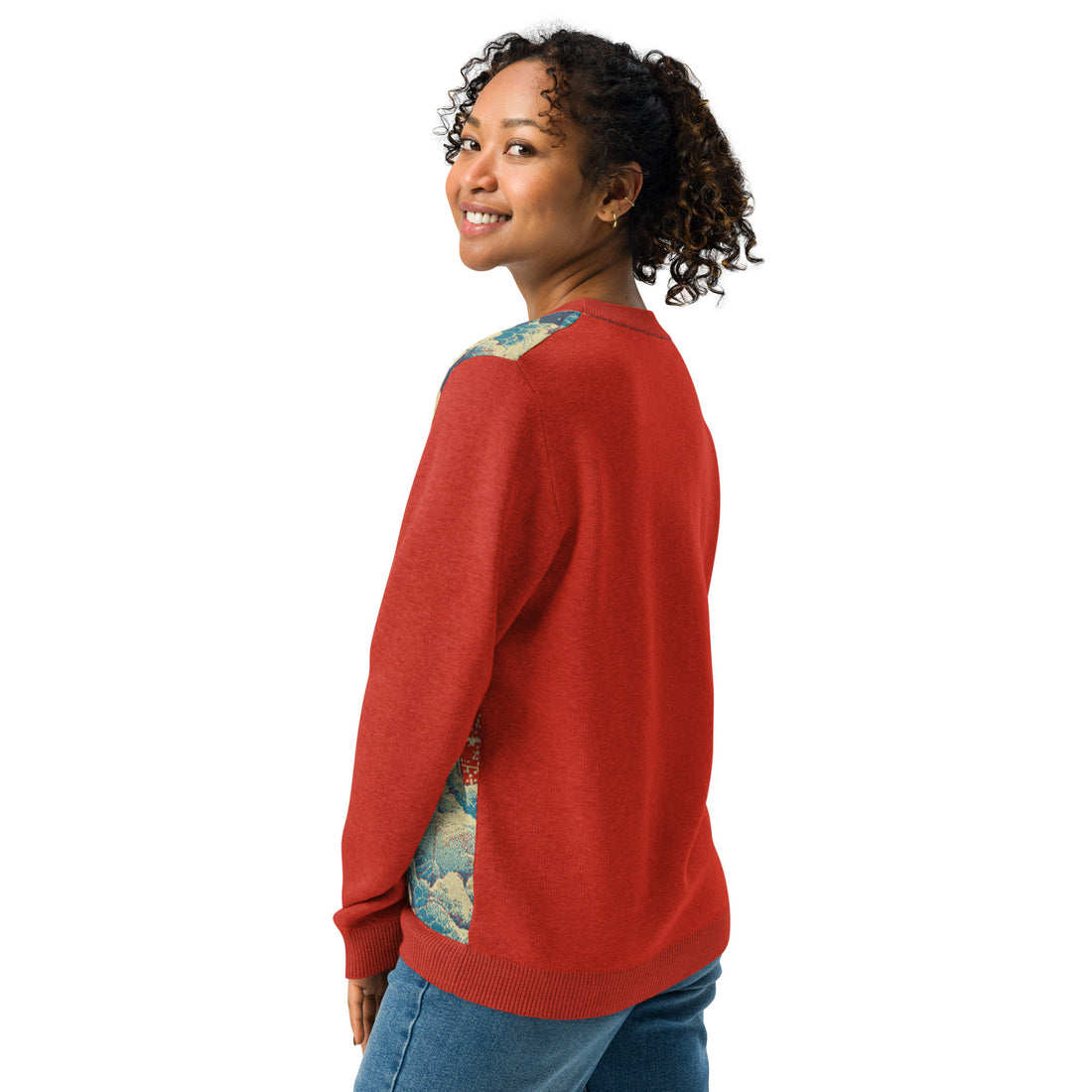 Red and blue artistic wave-pattern knitted sweater, crew neck, showcasing autumn hues.