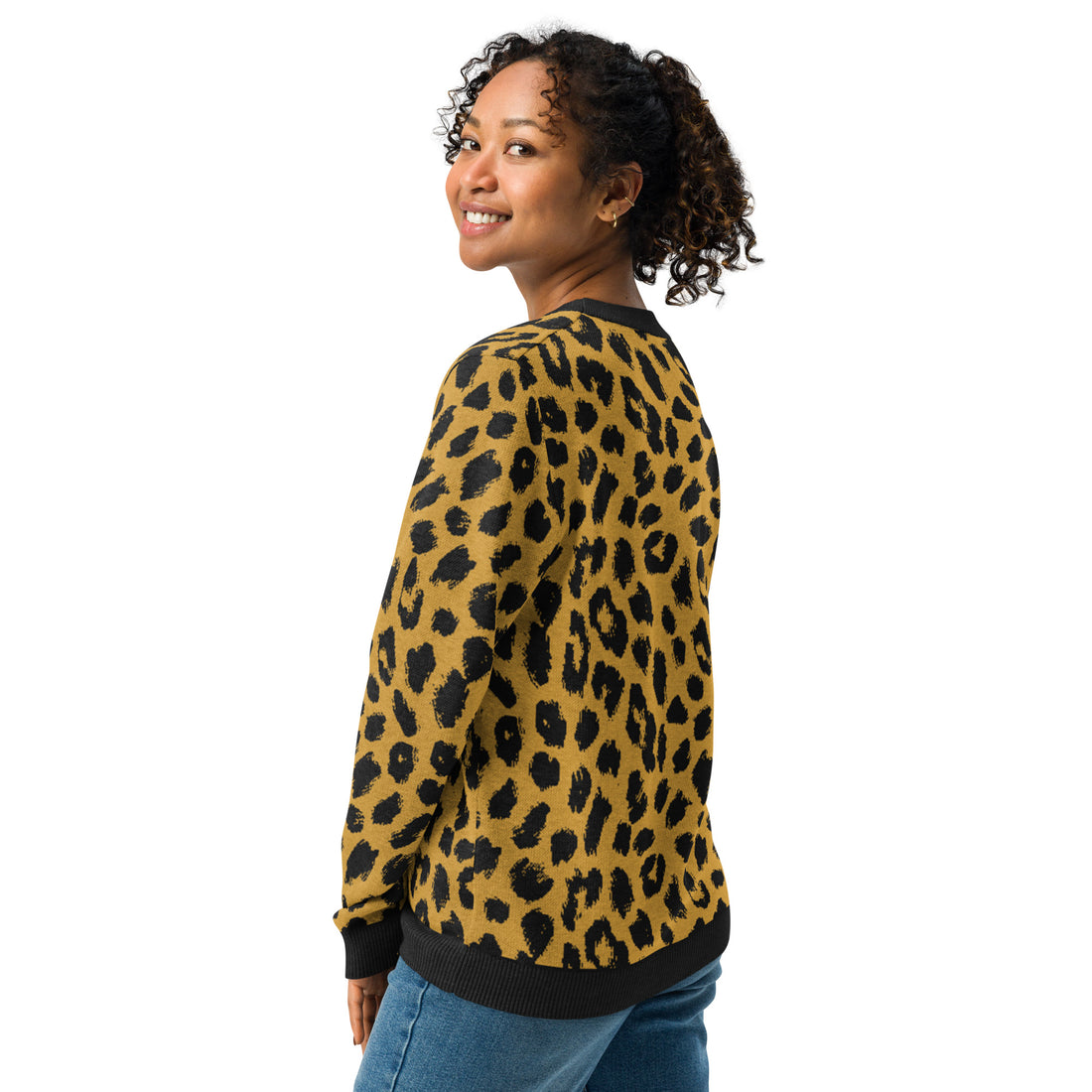 Woman wearing a leopard print knitted crew neck sweater with black trim, emphasizing fall fashion trends, autumnal style, and cozy comfort.