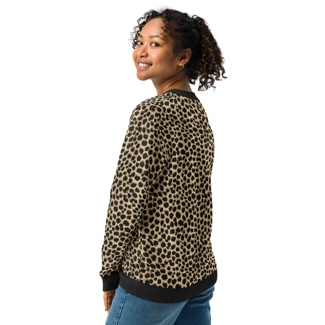 Woman wearing a cozy leopard print knit sweater with crew neck, perfect for fall and winter fashion, featuring a soft fabric.