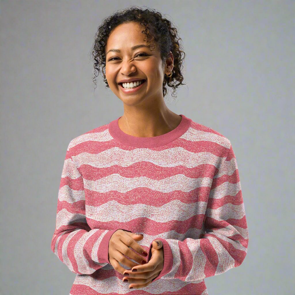 Woman wearing a knitted sweater with rose and cream wave pattern, ideal for fall fashion.