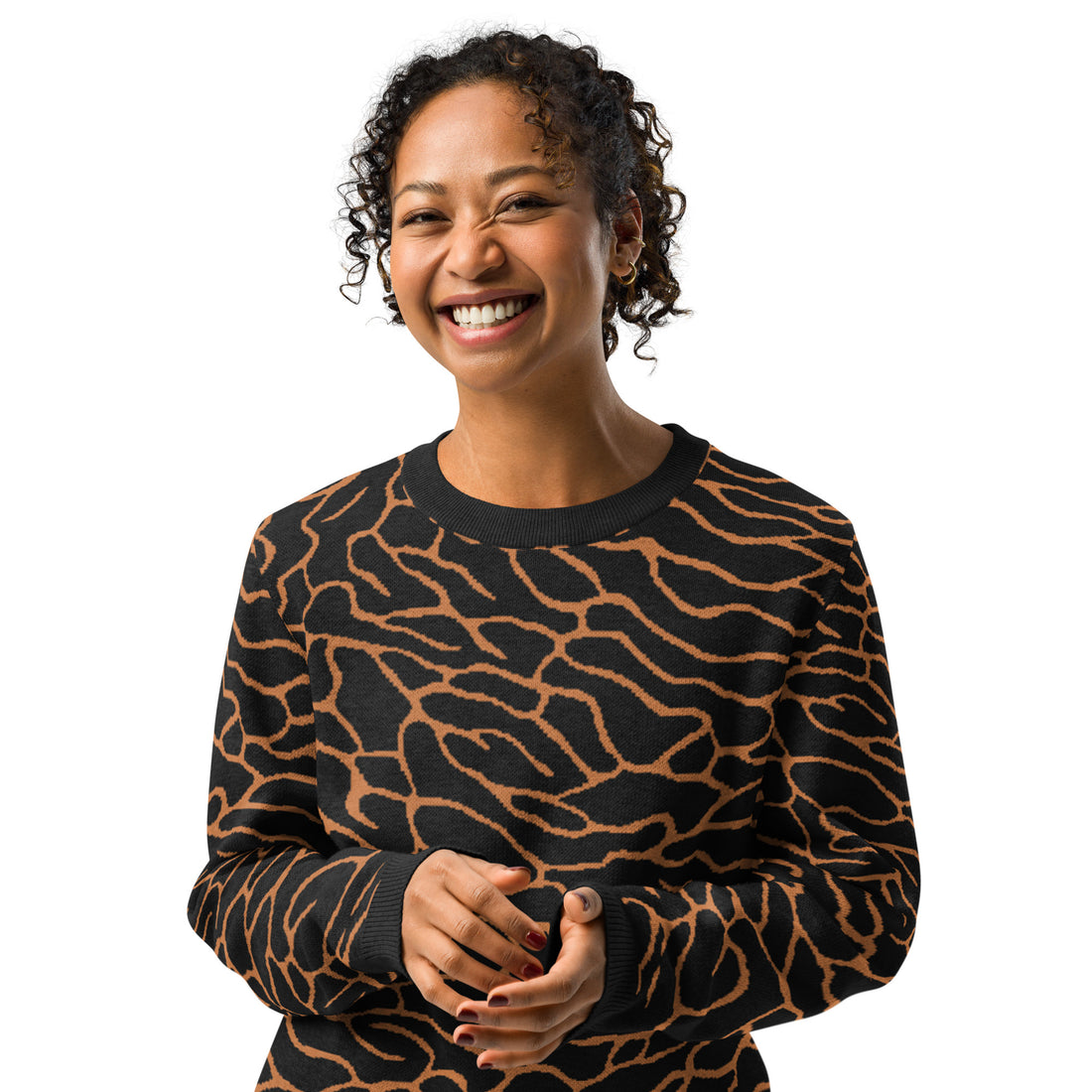 A woman wearing a zebra-patterned knit sweater in warm fall colors, featuring a comfortable crew neck design