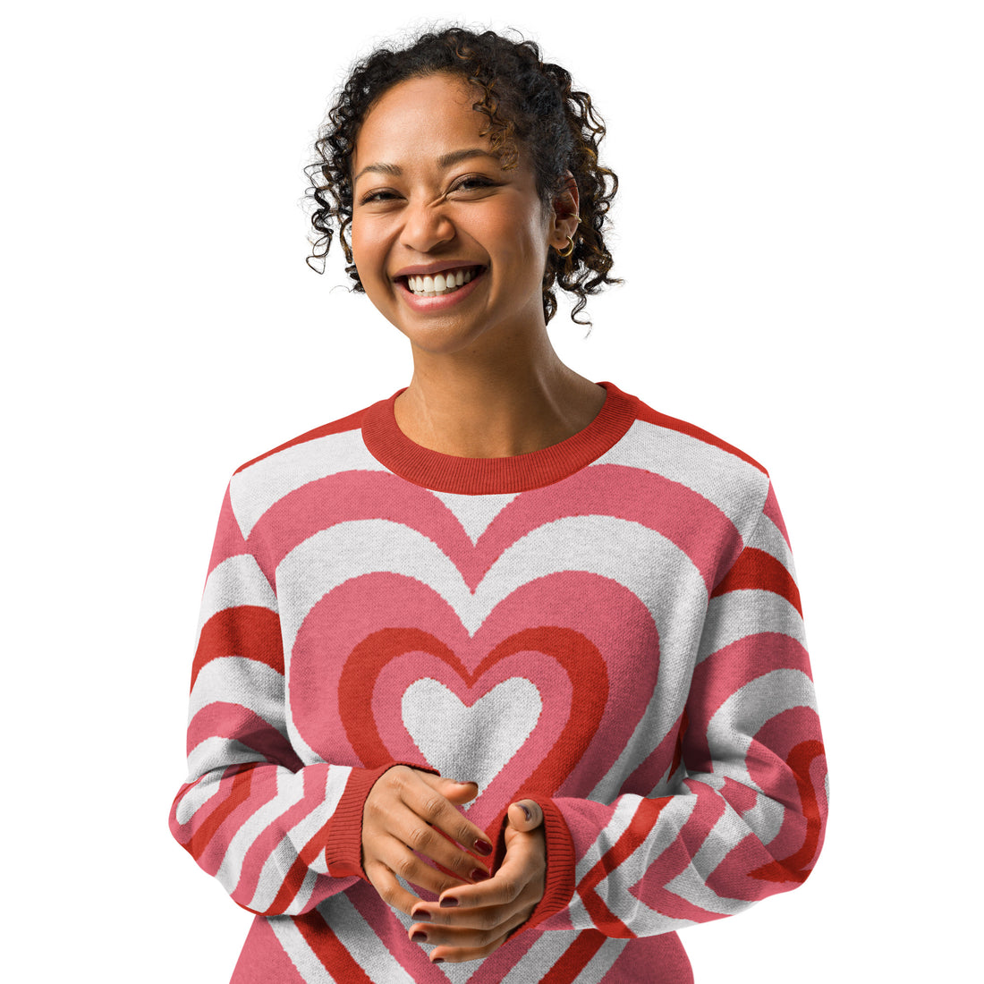 Heart-patterned knit sweater in pink and red shades, featuring a cozy and striking design perfect for fall and winter fashion.