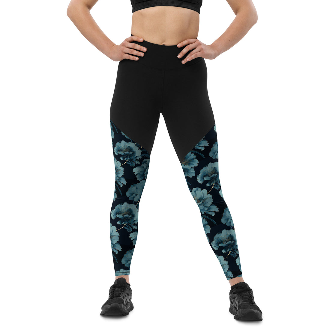 High-waisted floral sports leggings with black and teal floral design on leggings.