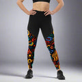 Vibrant compression sports leggings with colorful abstract patterns, high-waisted design, and black contrasting fabric.