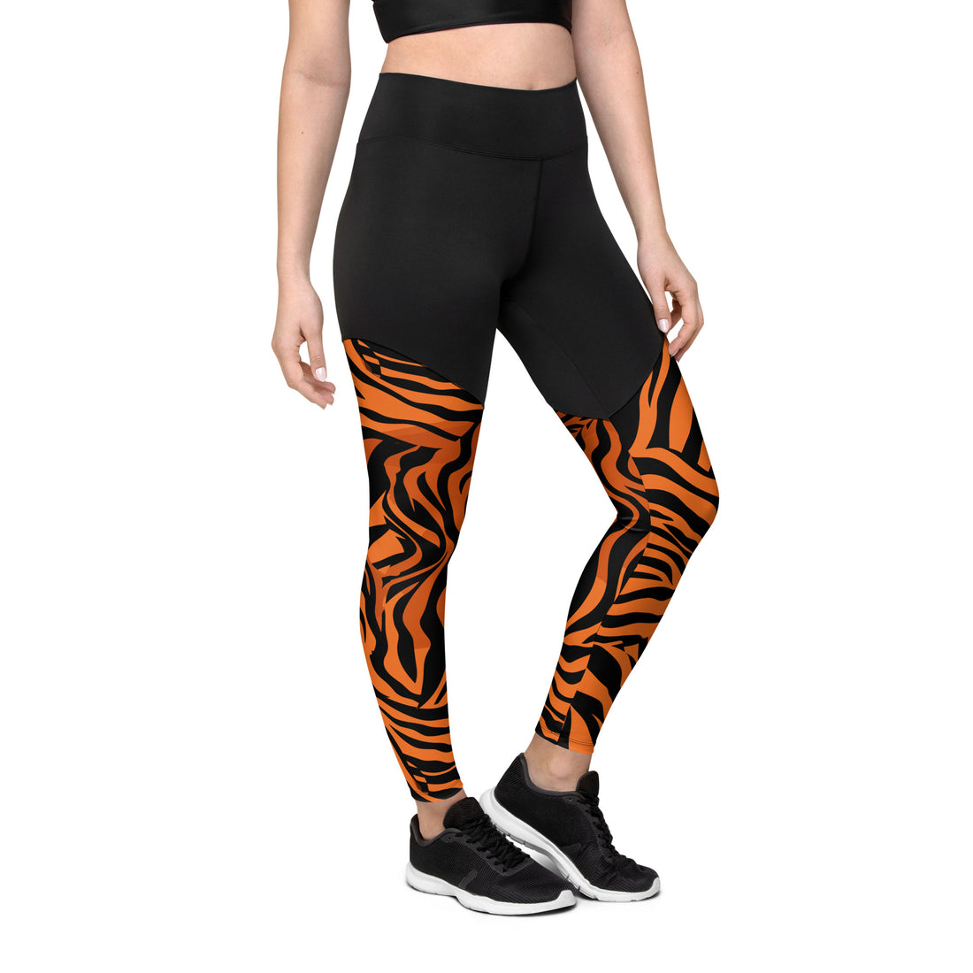 Tiger print sports leggings in black and orange with high-waisted design.