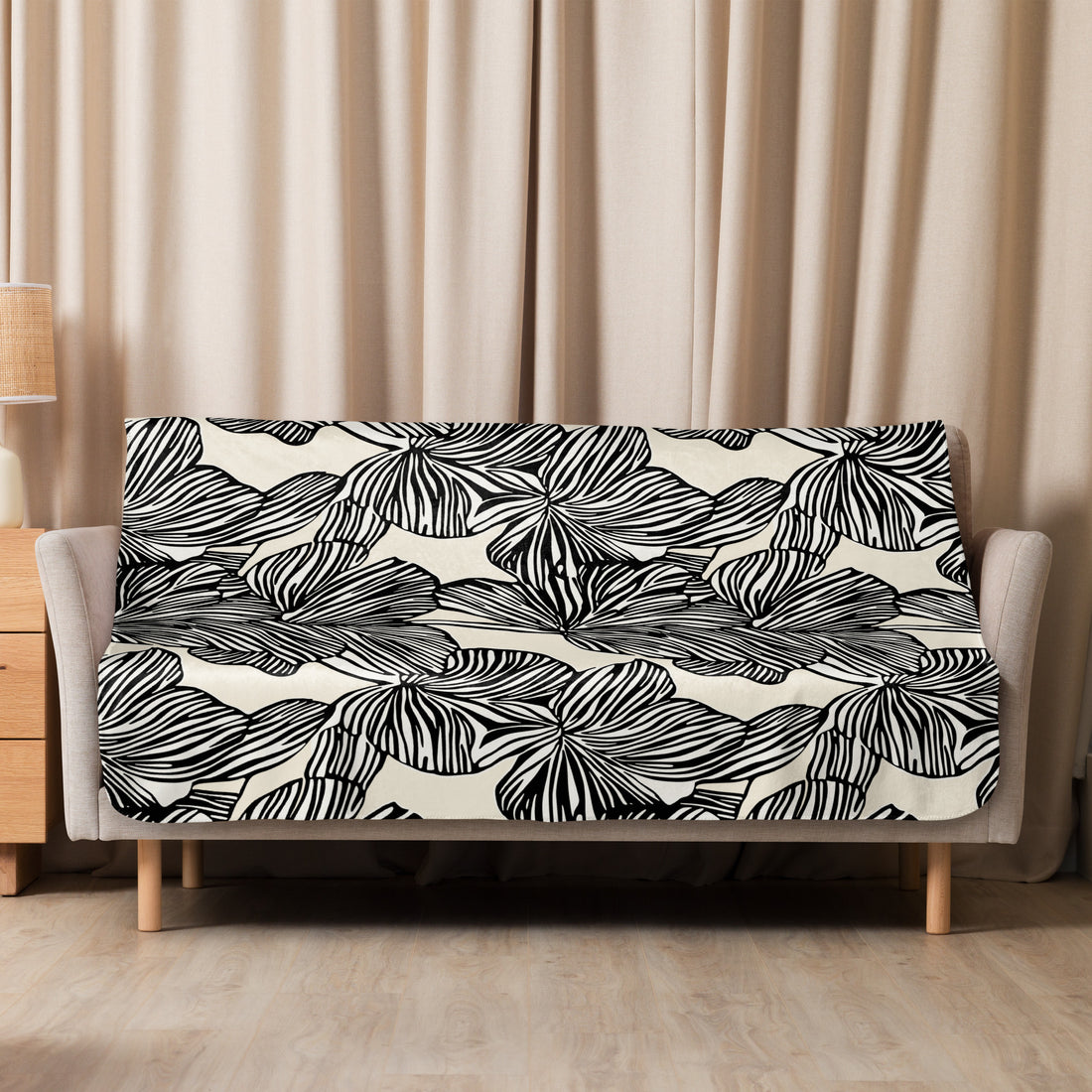 Plush Zebra Leaf Sherpa Blanket in black and white, showcasing a unique monochrome leaf design, perfect for fall and winter coziness.