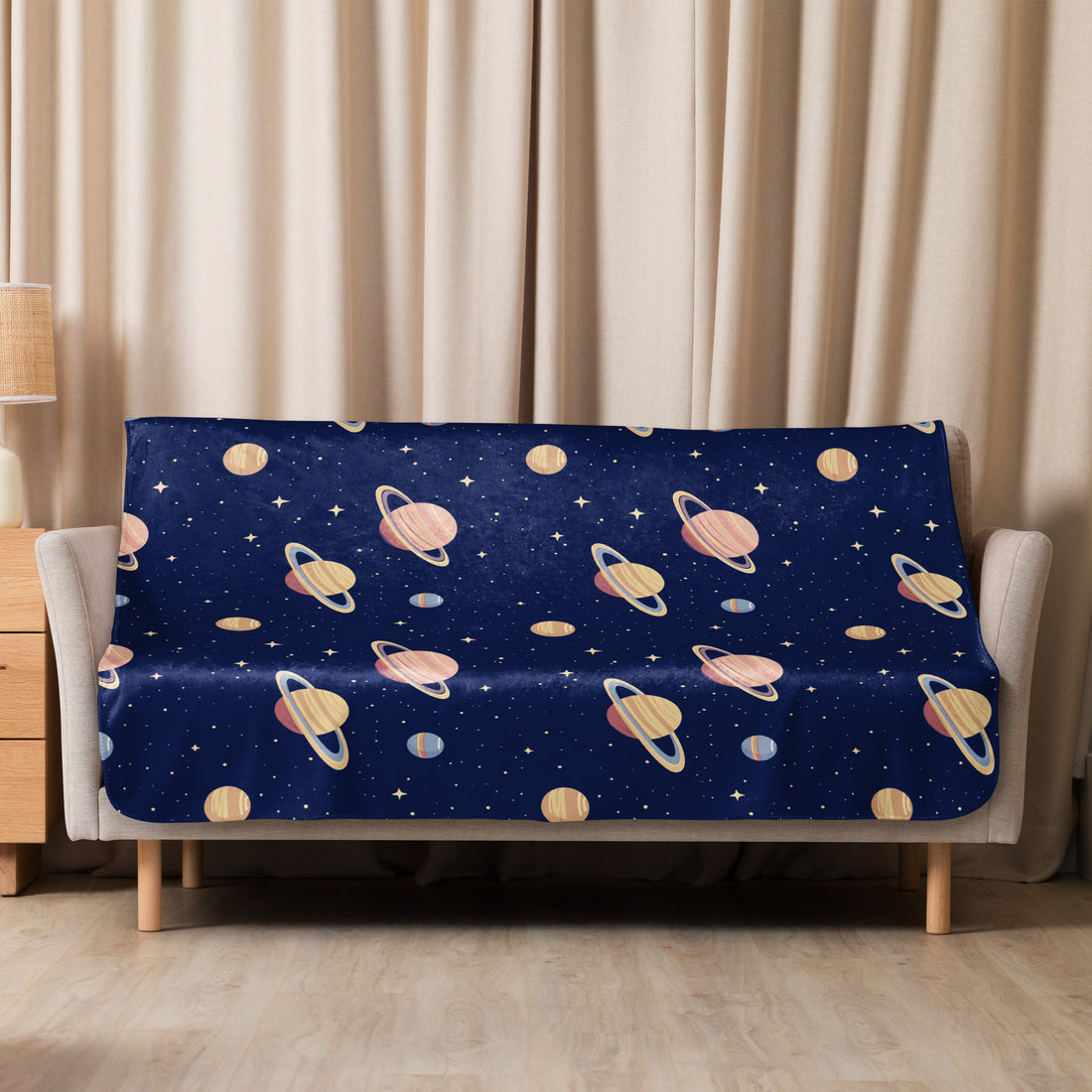 Navy sherpa blanket with a cosmic planetary design, featuring Saturn and celestial stars, ideal for autumn and winter coziness.