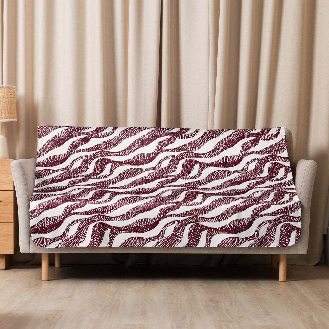 Elegant sherpa blanket with chocolate swirl wave pattern, offering plush comfort for fall and winter.