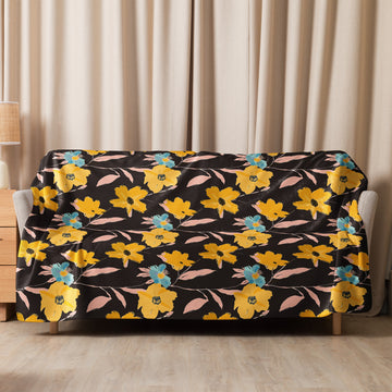 Floral Harmony Sherpa Blanket with vibrant yellow and teal blooms on a black background, perfect for winter coziness.