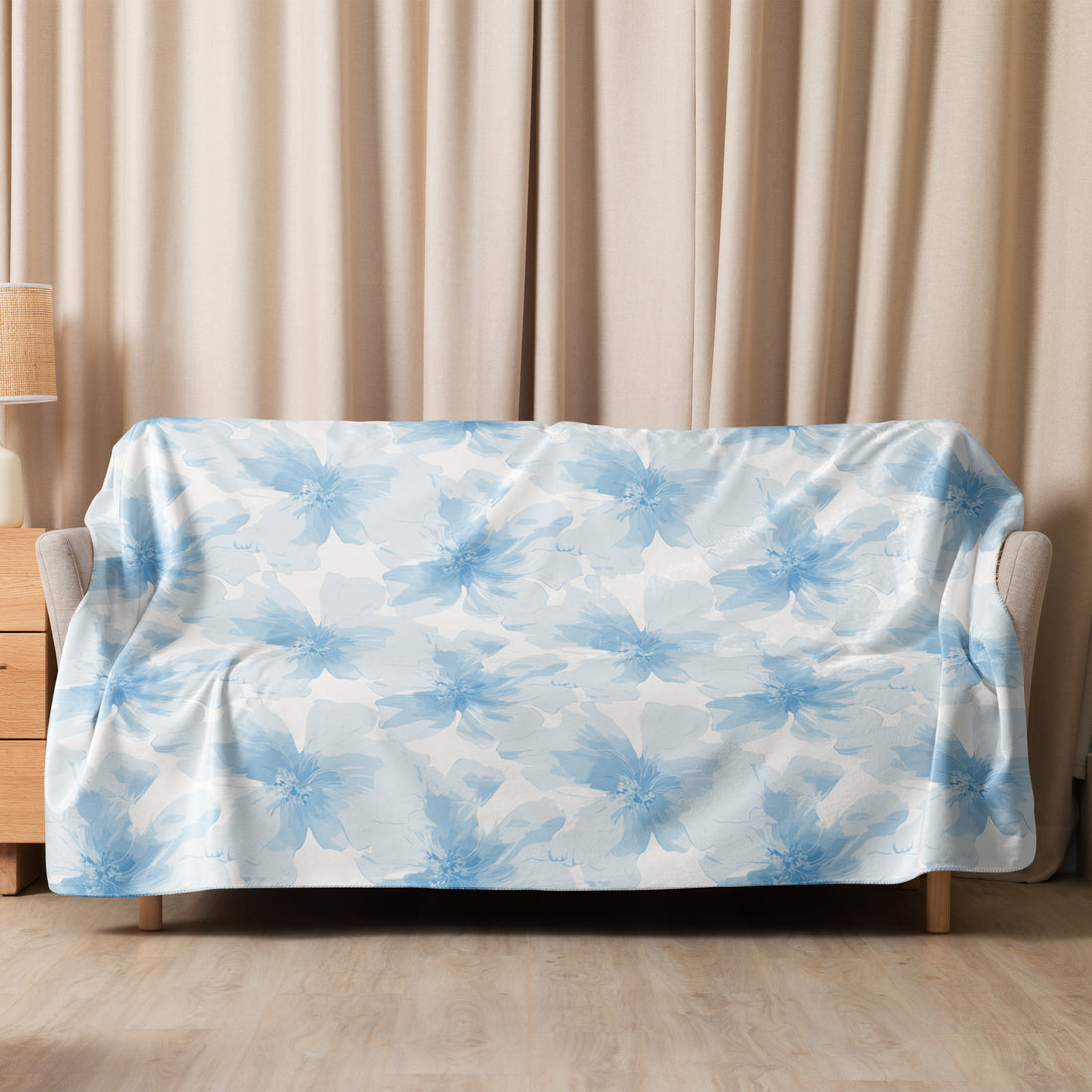 Blanket with soft blue floral design, cozy for winter lounging