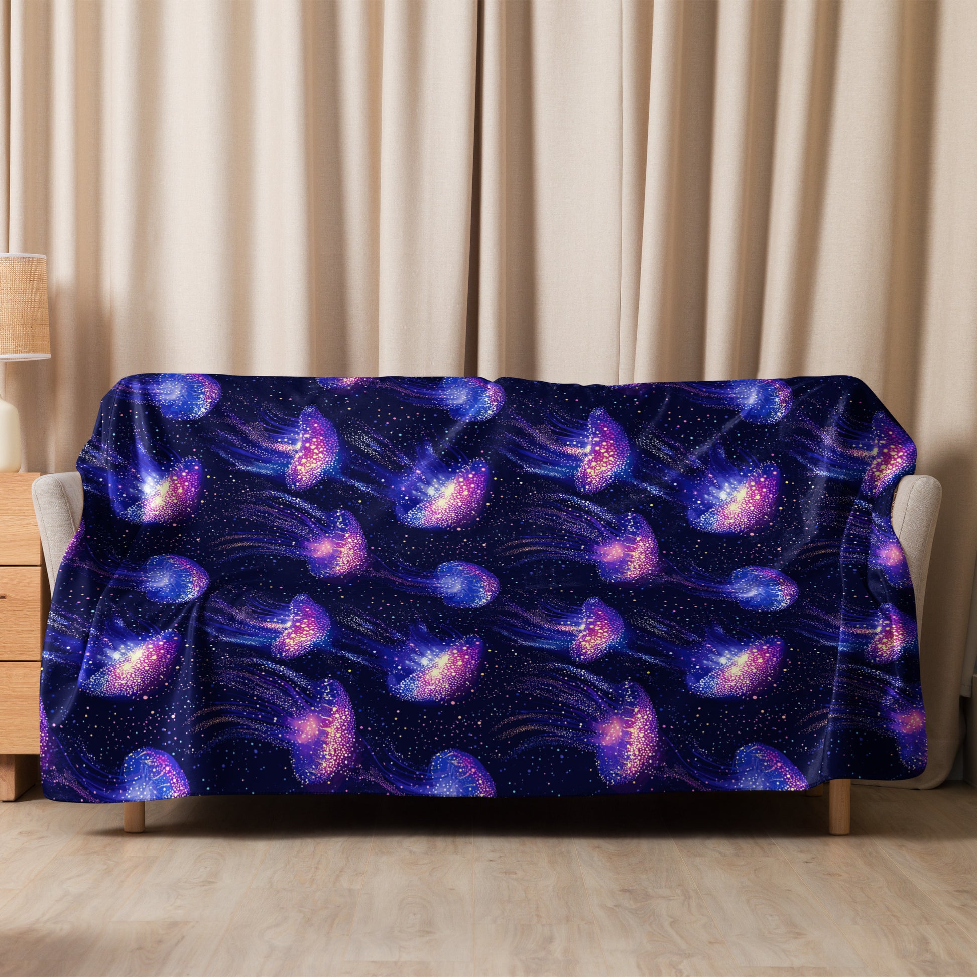 Galaxy-themed jellyfish sherpa blanket with vibrant stars and cosmic patterns on a cozy setting.