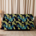 Vibrant sherpa blanket with reptile scale design in blue, yellow, and black.