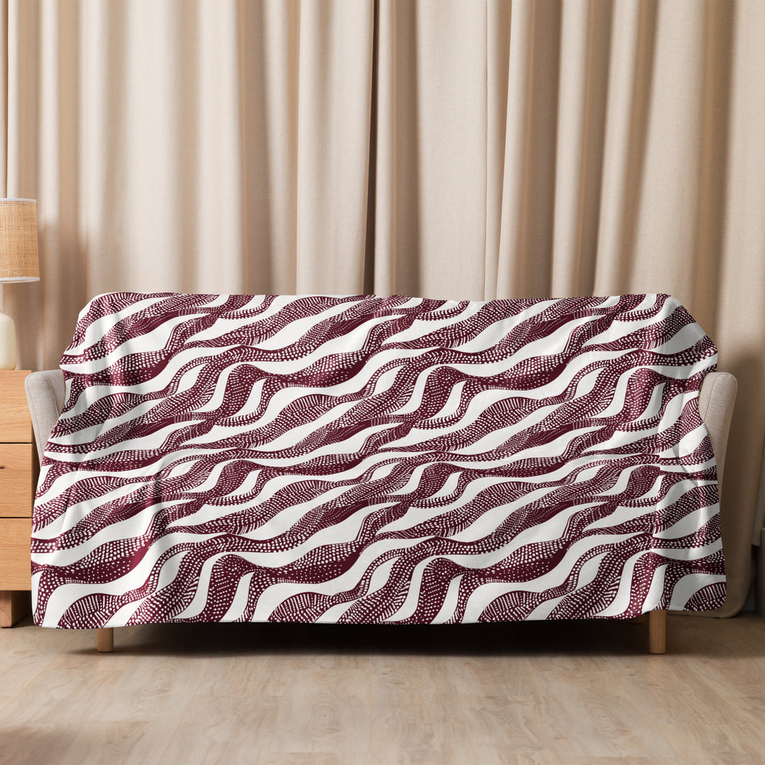 Elegant sherpa blanket with chocolate swirl wave pattern, offering plush comfort for fall and winter.