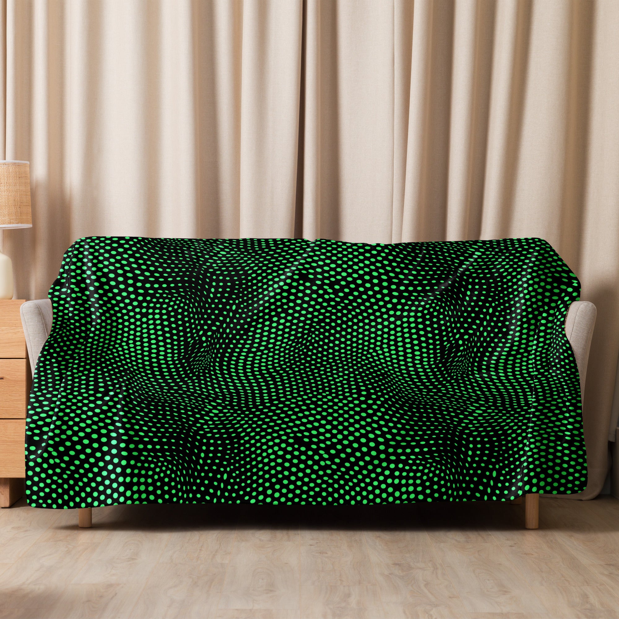 Green dot pattern sherpa blanket on sofa with beige curtains, cozy winter decor