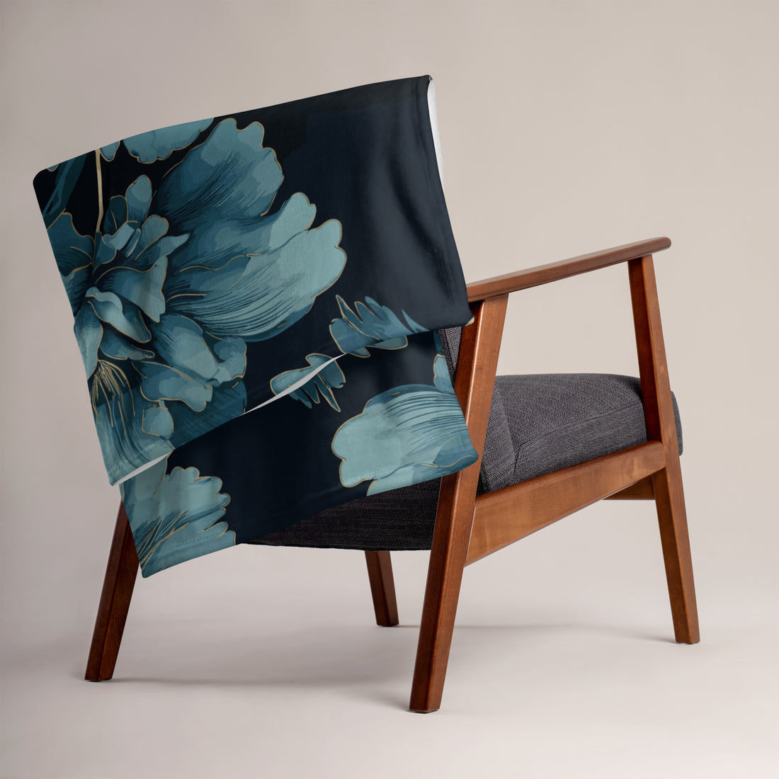 Floral silk touch throw blanket draped over a wooden chair, featuring large blue flowers on a dark background.