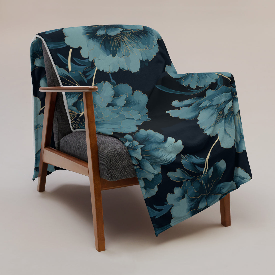 Floral silk touch throw blanket draped over a wooden chair, featuring large blue flowers on a dark background.