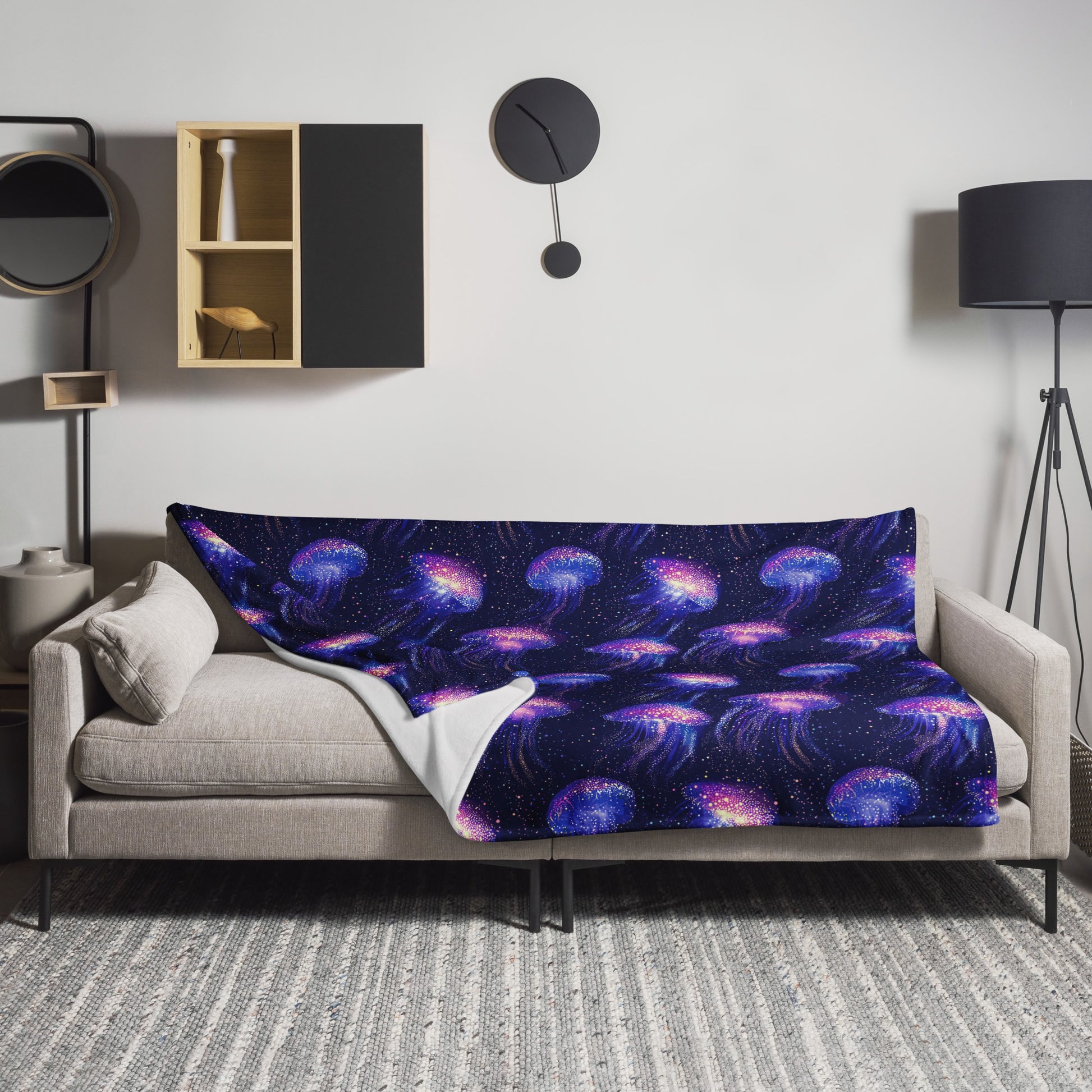 Galactic Jellyfish Throw Blanket featuring vibrant cosmic ocean design on a cozy couch.