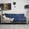 A navy blue throw blanket with an intricate cloud pattern design, soft silk touch fabric, ideal for winter coziness.